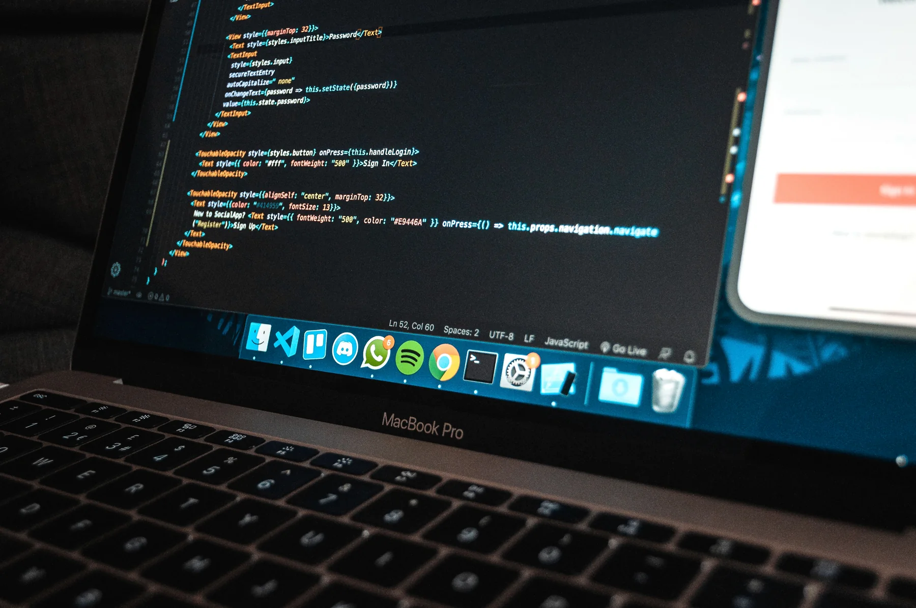 Software code displayed on a laptop